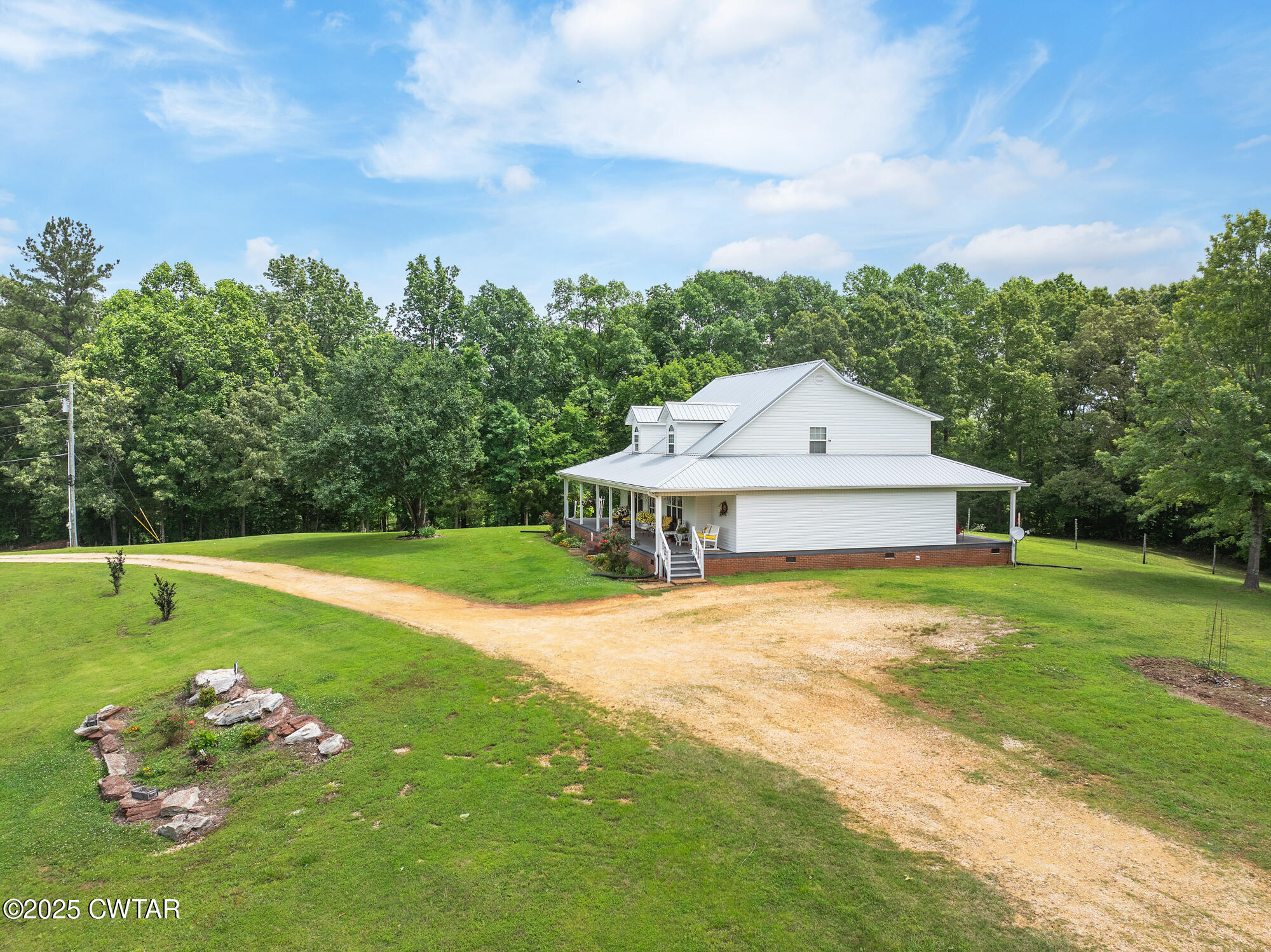 1401 Camper Road Decaturville, TN 38329 - Photo 13 of 40 a front view of a house with garden