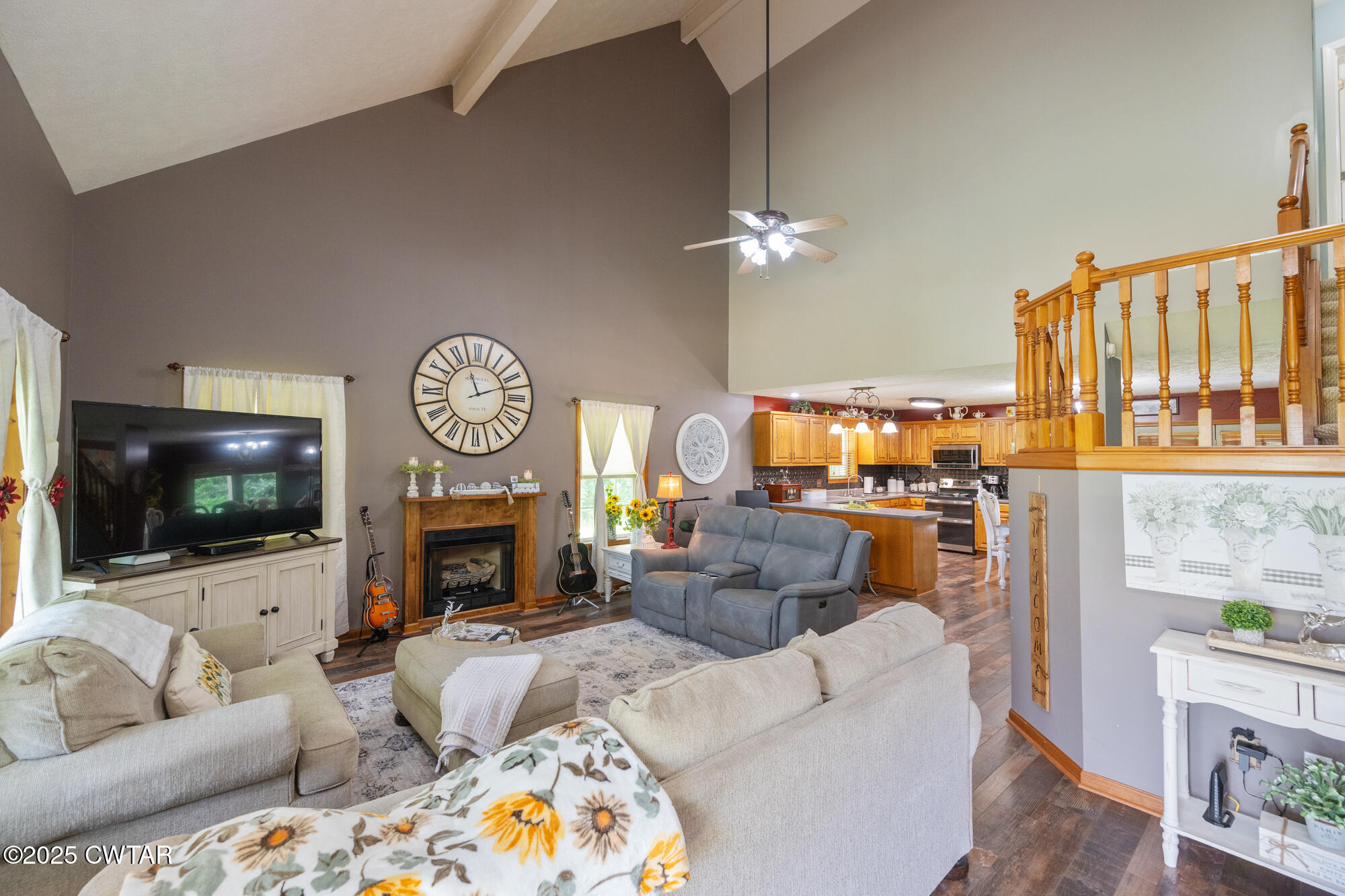 1401 Camper Road Decaturville, TN 38329 - Photo 14 of 40 a living room with fireplace furniture and a flat screen tv