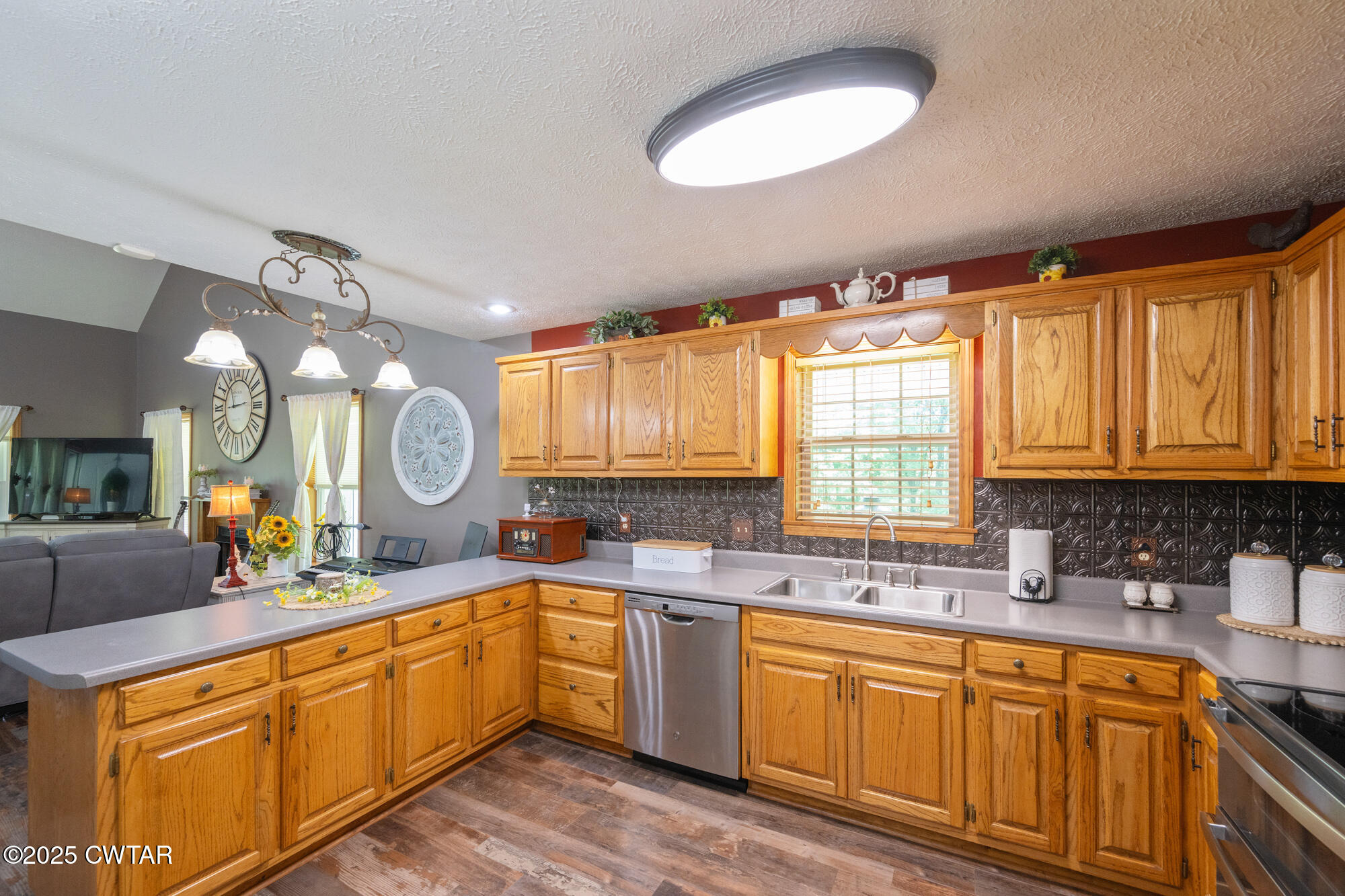 1401 Camper Road Decaturville, TN 38329 - Photo 19 of 40 a kitchen with a sink cabinets and window