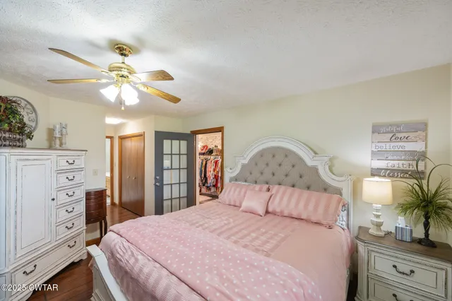 a view of walk in closet with clothes
