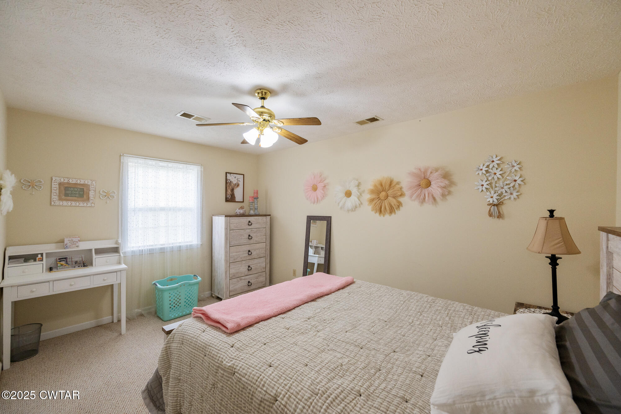 1401 Camper Road Decaturville, TN 38329 - Photo 32 of 40 a bedroom with a bed dresser and a window