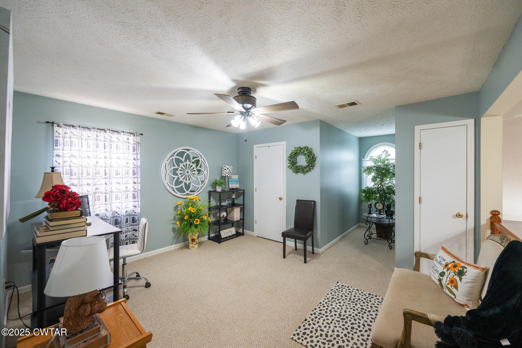 1401 Camper Road Decaturville, TN 38329 - Photo 33 of 40 a view of a livingroom with furniture and a chandelier