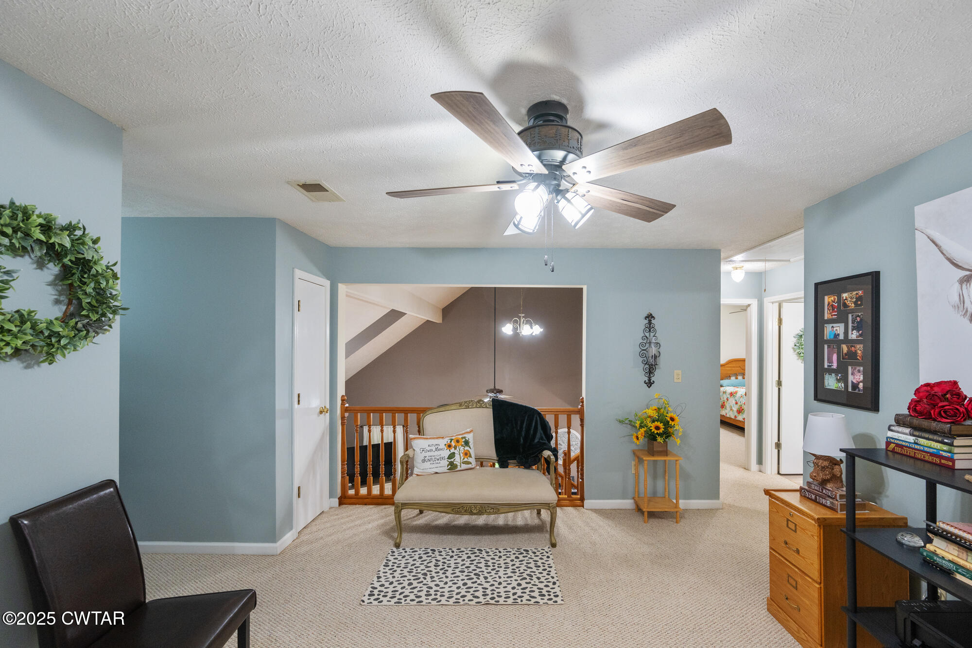 1401 Camper Road Decaturville, TN 38329 - Photo 34 of 40 a living room with furniture and a chandelier