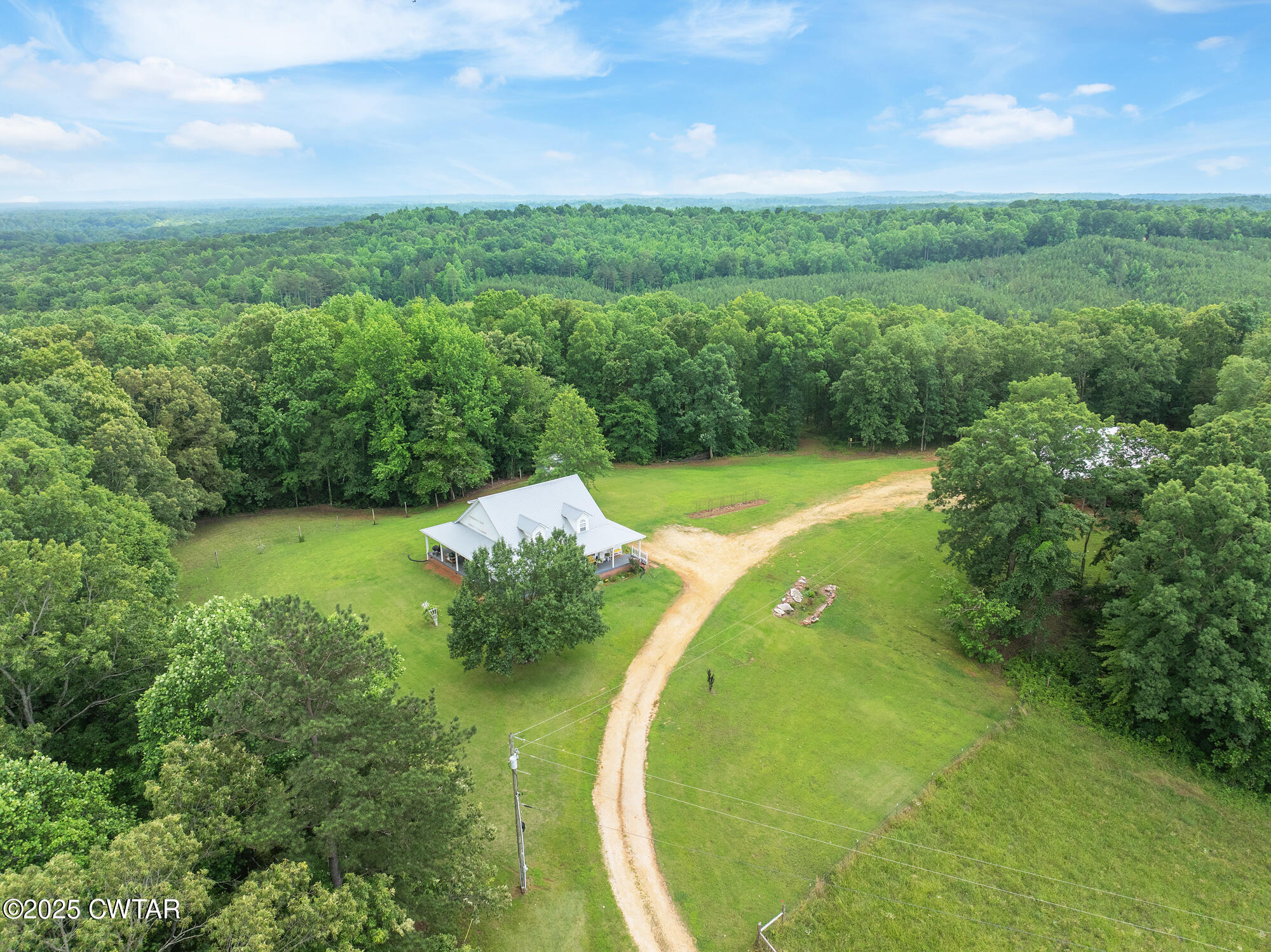 1401 Camper Road Decaturville, TN 38329 - Photo 7 of 40 a view of a golf course with a swimming pool