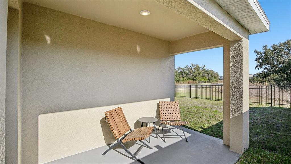 1060 Spotted Egret Loop Ruskin, FL 33570 - Photo 25 of 26 a view of chair and table in the balcony