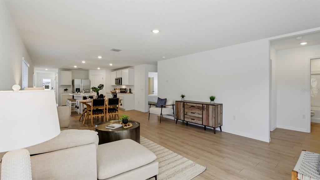 1060 Spotted Egret Loop Ruskin, FL 33570 - Photo 5 of 26 a living room with furniture and a wooden floor