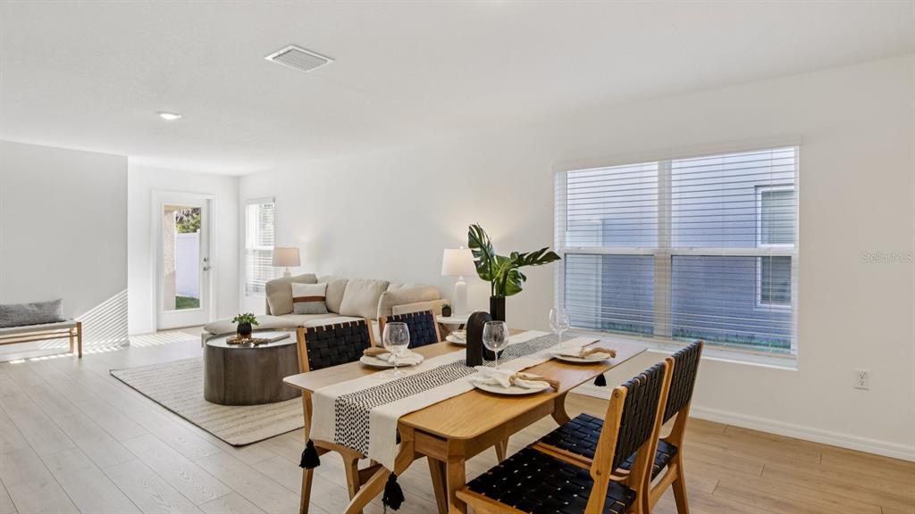 1060 Spotted Egret Loop Ruskin, FL 33570 - Photo 7 of 26 a view of a dining room with furniture window and wooden floor