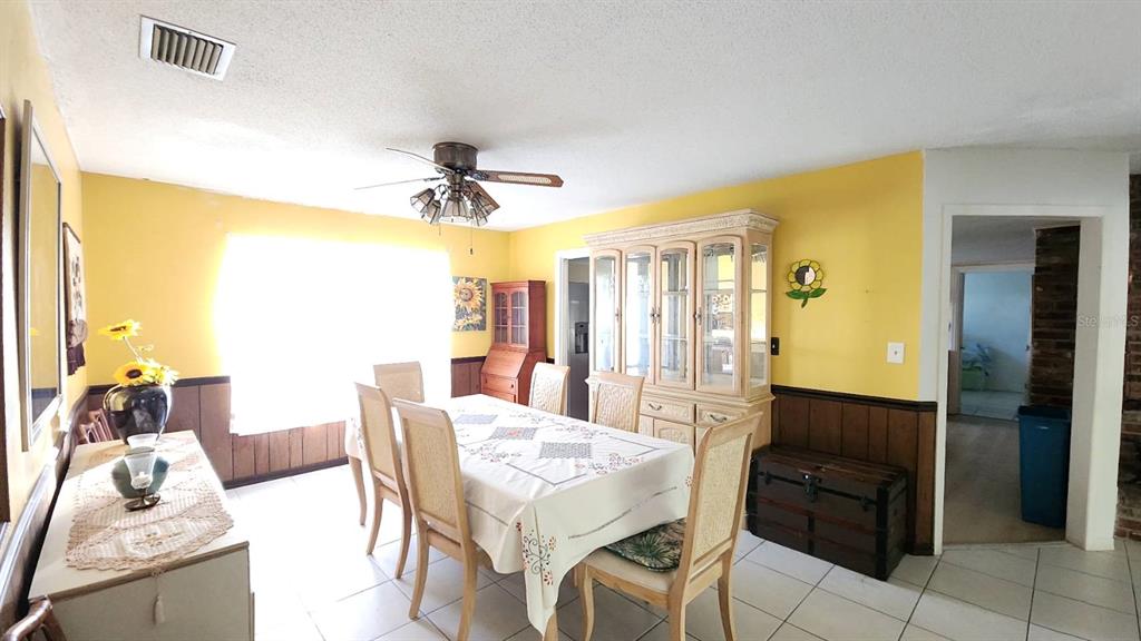 2405 Neptune Road Kissimmee, FL 34744 - Photo 14 of 17 a view of a livingroom with furniture and a window