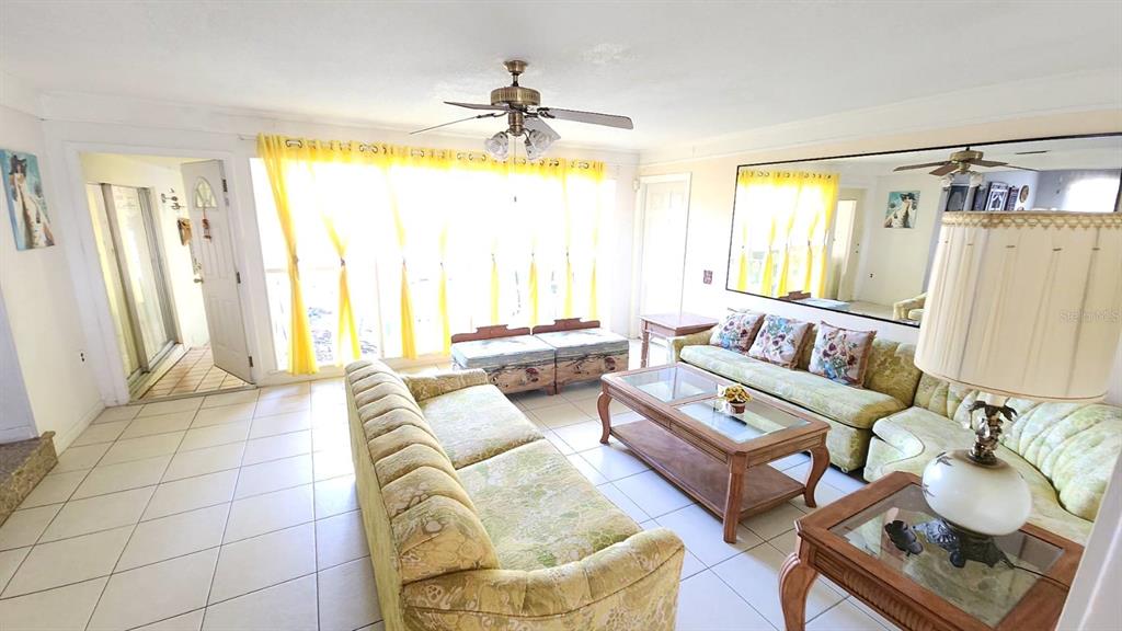 2405 Neptune Road Kissimmee, FL 34744 - Photo 15 of 17 a living room with furniture and a large window