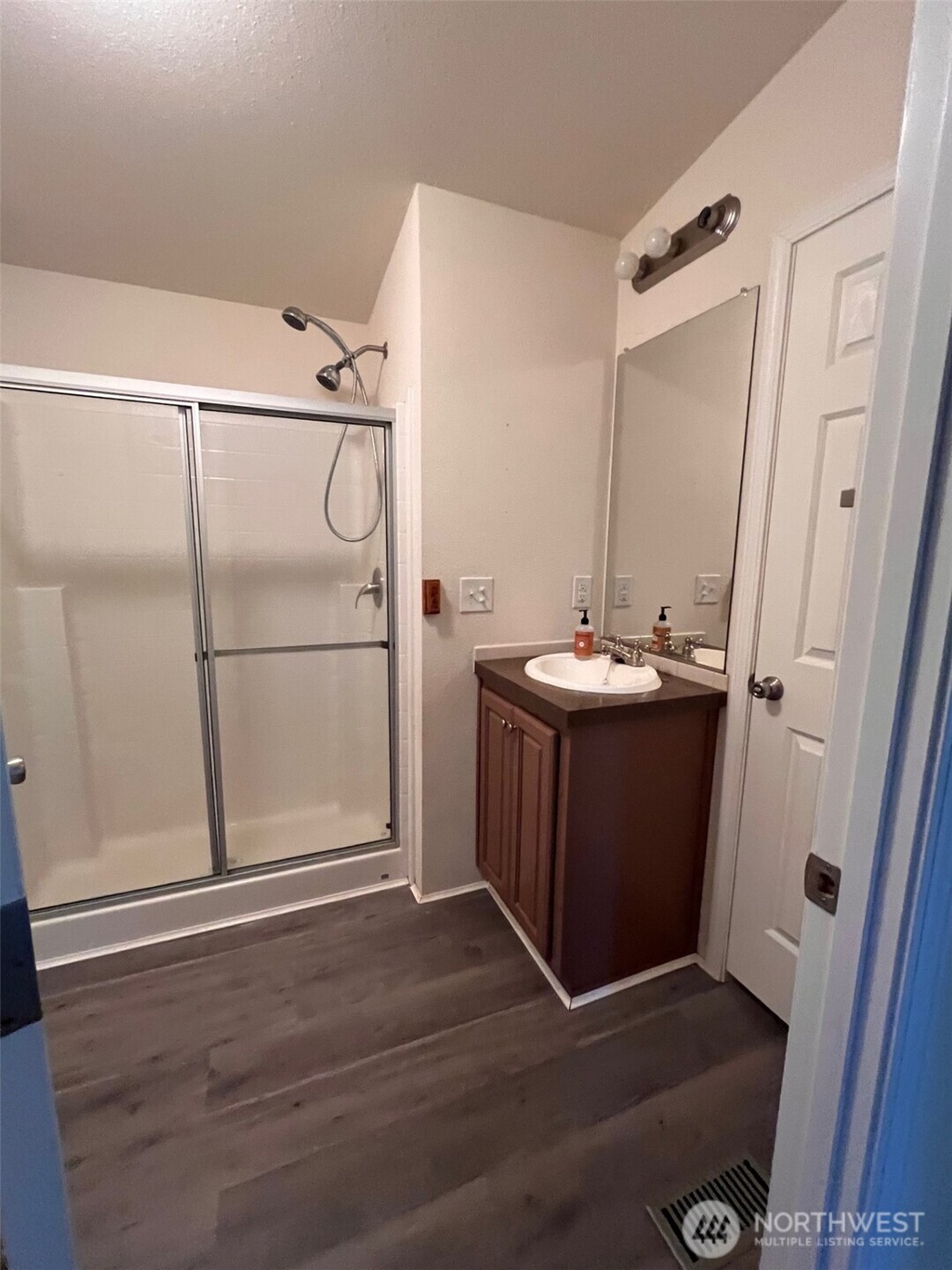 4731 East Rasor Road Belfair, WA 98528 - Photo 13 of 21 a bathroom with a sink mirror and shower