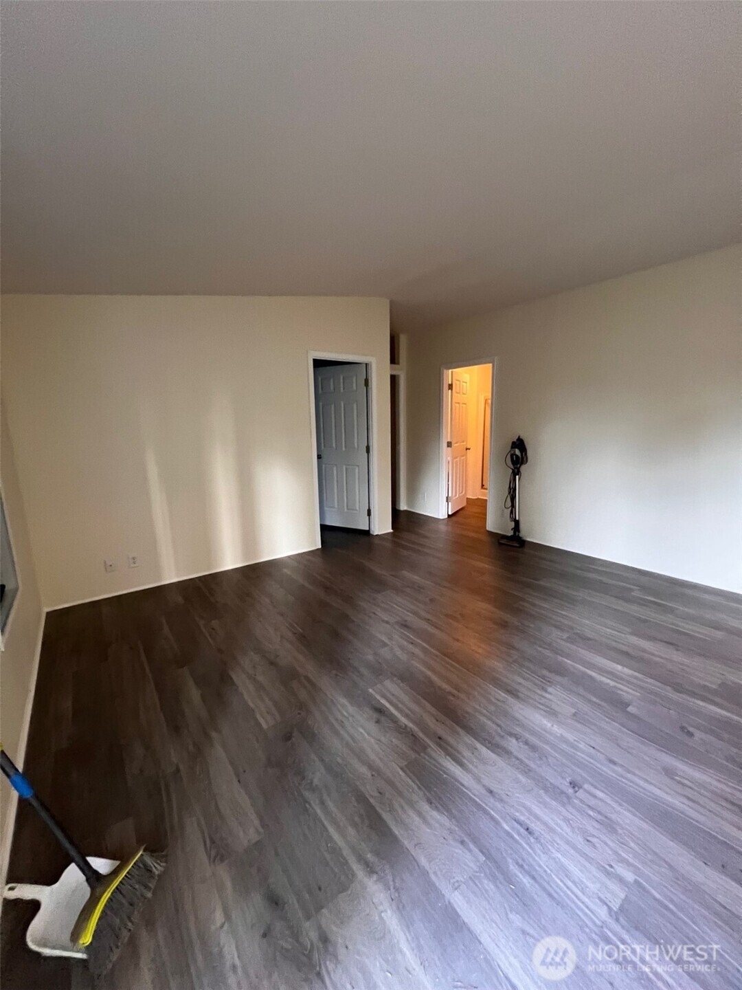 4731 East Rasor Road Belfair, WA 98528 - Photo 7 of 21 a view of an empty room and wooden floor