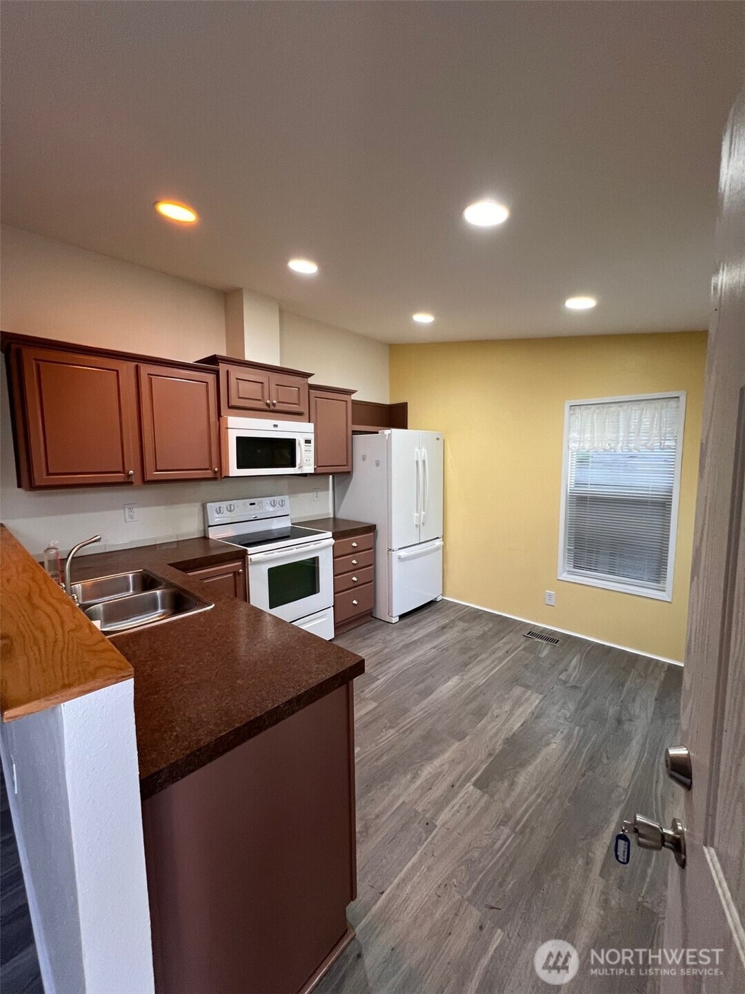 4731 East Rasor Road Belfair, WA 98528 - Photo 9 of 21 a kitchen with stainless steel appliances a refrigerator a stove top oven a sink and dishwasher