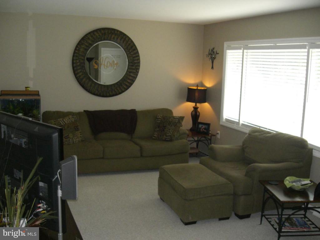 204 North Elm Street Lititz, PA 17543 - Photo 8 of 11 a living room with furniture and a flat screen tv