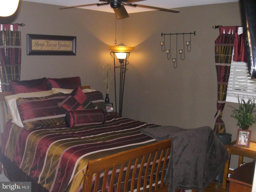 204 North Elm Street Lititz, PA 17543 - Photo 9 of 11 a bedroom with a bed and a potted plant