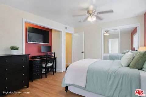 a bedroom with a bed and a dresser