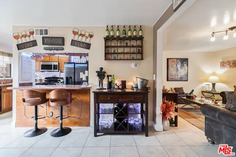 a living room with granite countertop furniture and a fireplace