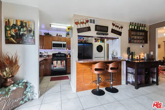 a kitchen with a stove and a refrigerator