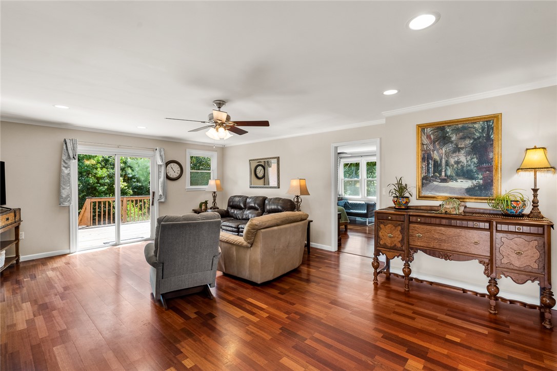 512 East Fredericks Street Anderson, SC 29621 - Photo 6 of 31 Rich hardwood floors complement an inviting living space with direct access to an outdoor deck.