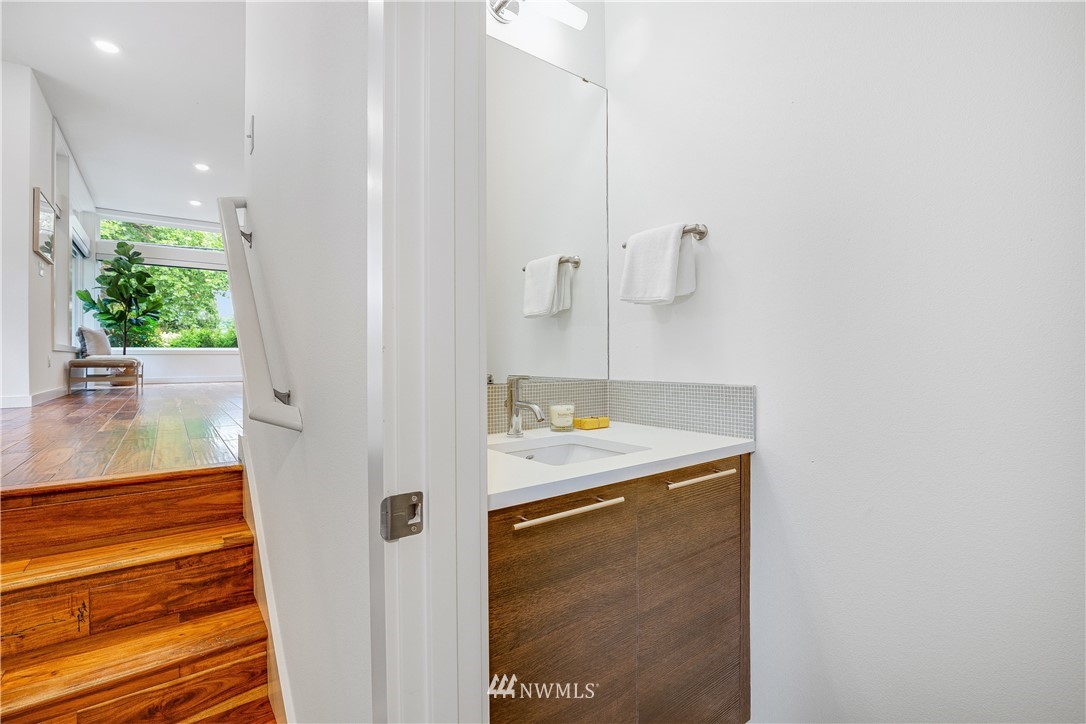 3217 East Spring Street Seattle, WA 98122 - Photo 11 of 33 a bathroom with a sink and mirror