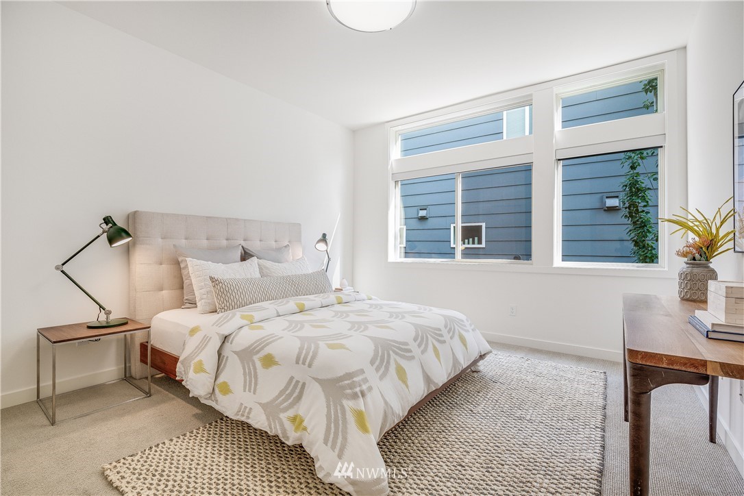 3217 East Spring Street Seattle, WA 98122 - Photo 20 of 33 a bedroom with a bed and window