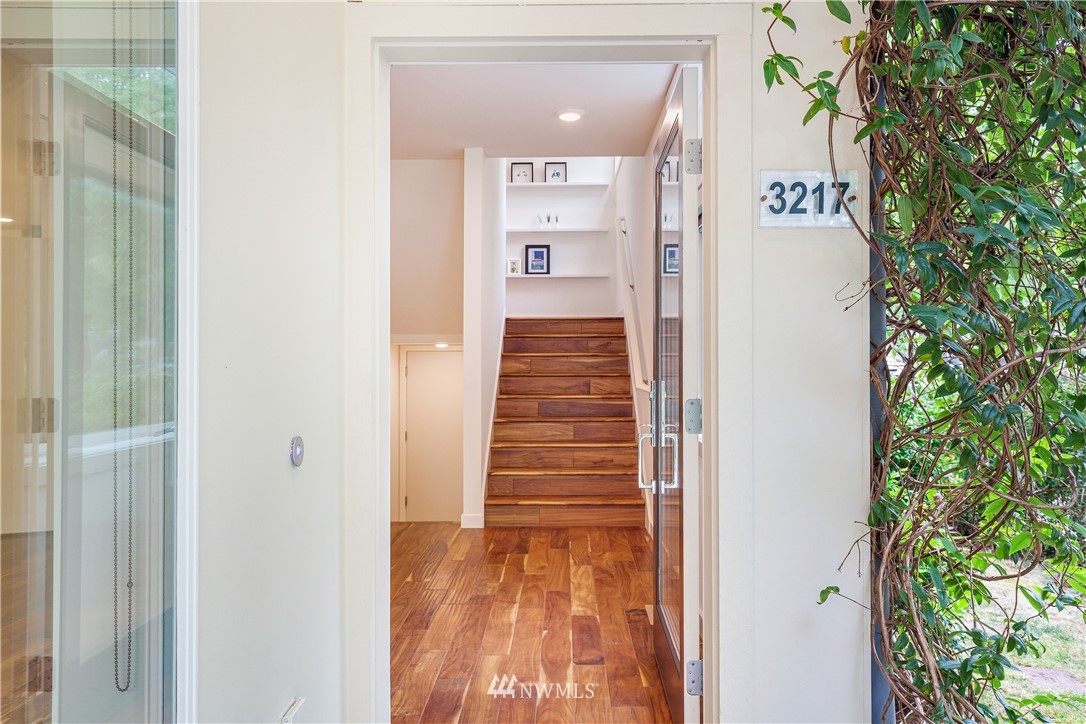 3217 East Spring Street Seattle, WA 98122 - Photo 3 of 33 a view of a hallway with wooden floor and entryway