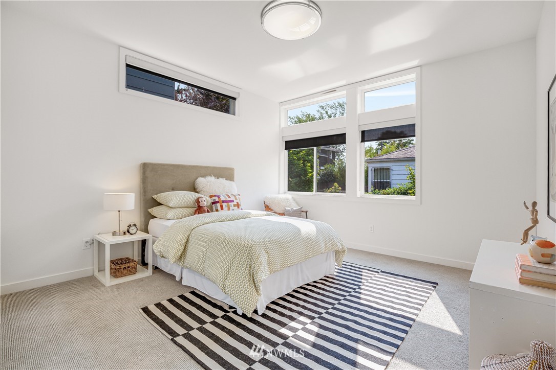 3217 East Spring Street Seattle, WA 98122 - Photo 21 of 33 a bedroom with a bed and a window
