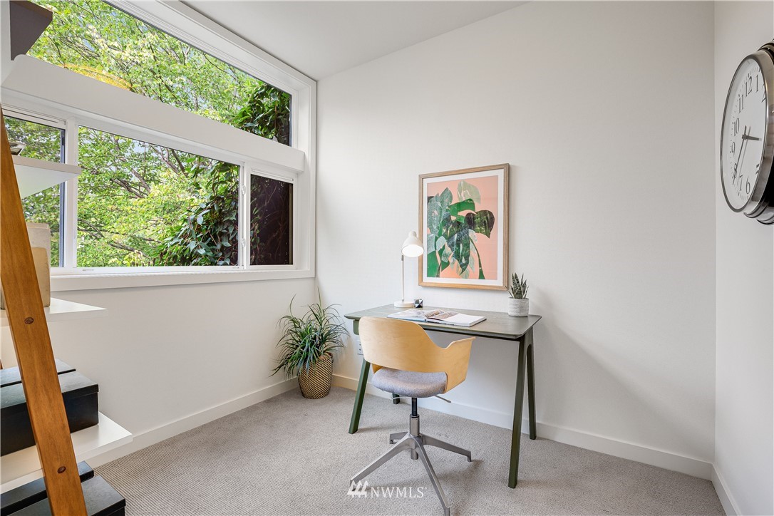 3217 East Spring Street Seattle, WA 98122 - Photo 24 of 33 a workspace room with furniture and a window