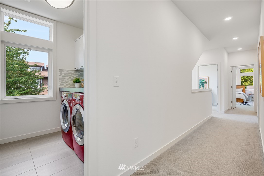 3217 East Spring Street Seattle, WA 98122 - Photo 25 of 33 a view of hallway with washer and dryer
