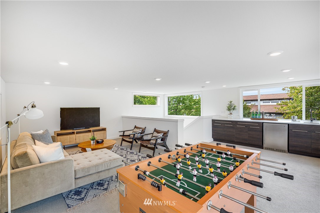 3217 East Spring Street Seattle, WA 98122 - Photo 26 of 33 a living room with furniture and a flat screen tv