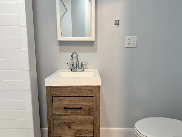 a bathroom with a sink and shower