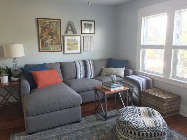 a living room with furniture and a window