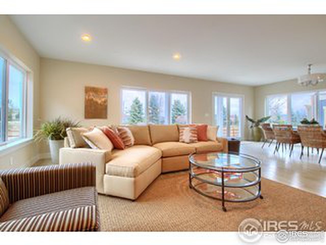 304 West Maple Street Superior, CO 80027 - Photo 16 of 16 a living room with furniture a large window and a dining table