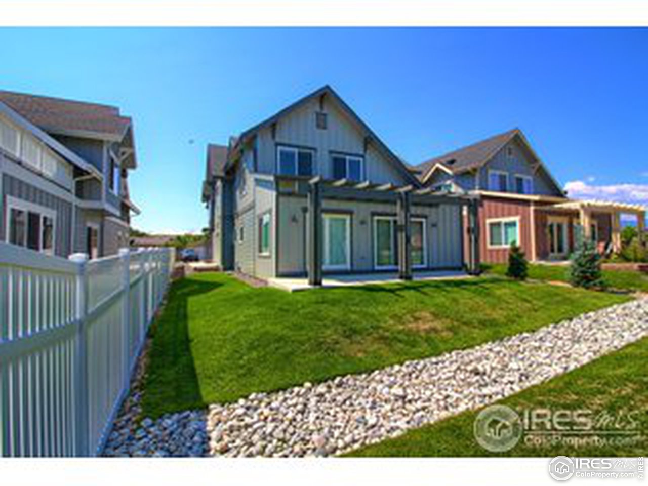 304 West Maple Street Superior, CO 80027 - Photo 8 of 16 a view of a big house with a big yard and potted plants