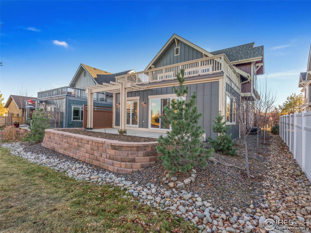 304 West Maple Street Superior, CO 80027 - Photo 9 of 16 a front view of a house with a garden