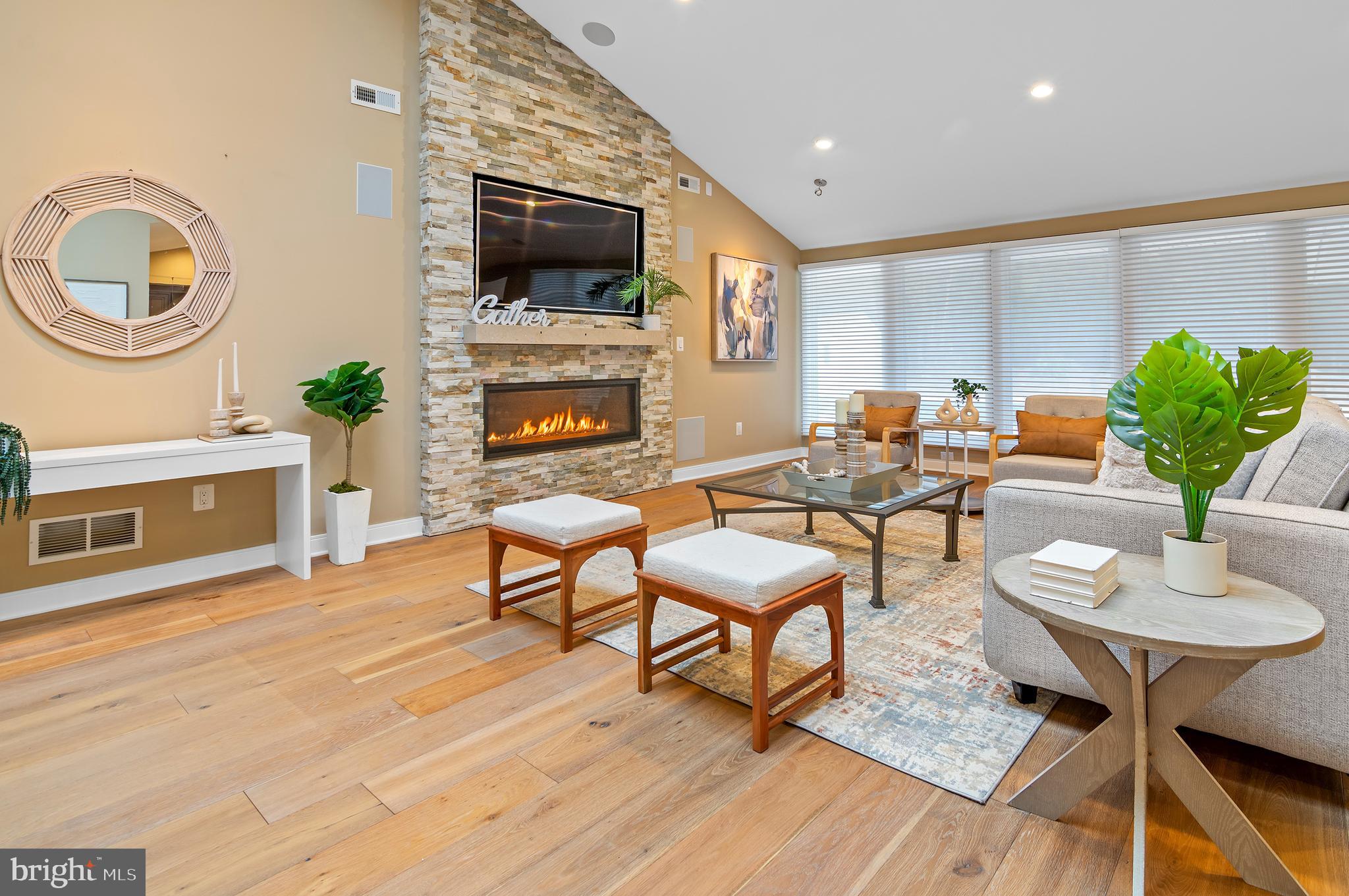 3521 Old Court Road Baltimore, MD 21208 - Photo 3 of 39 a living room with furniture a fireplace and a flat screen tv