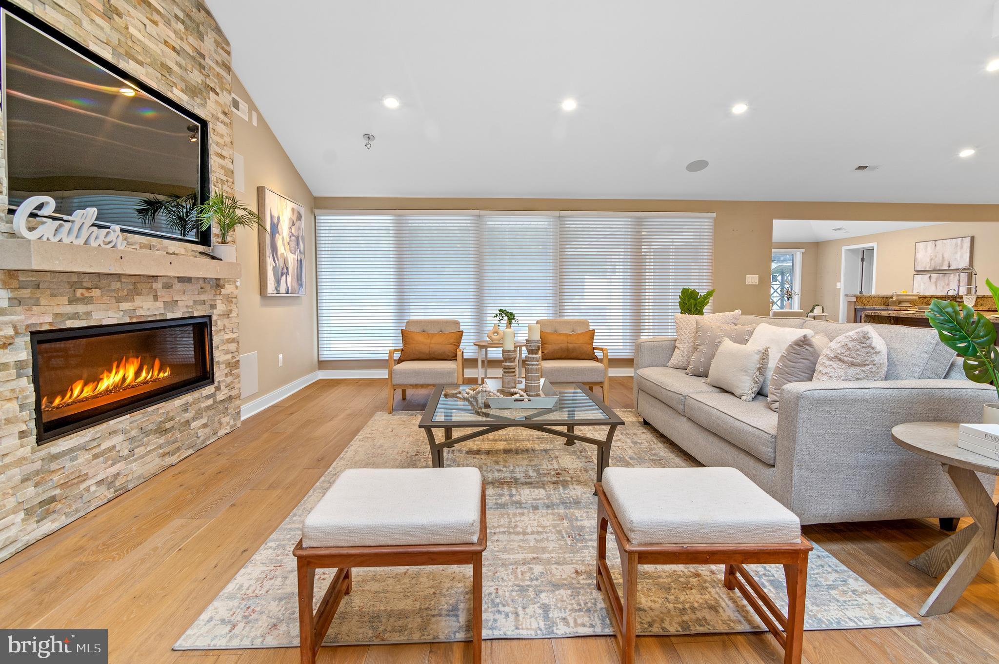 3521 Old Court Road Baltimore, MD 21208 - Photo 4 of 39 a living room with furniture a flat screen tv and a fireplace