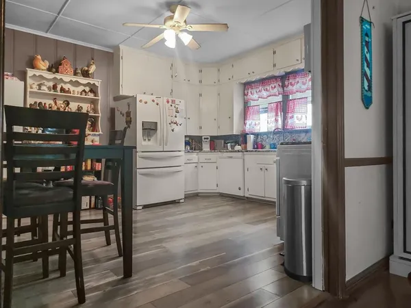 a kitchen with stainless steel appliances a refrigerator sink and cabinets
