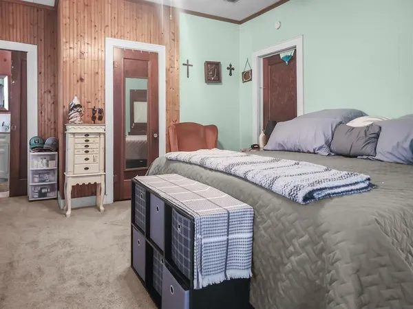 a bedroom with a bed and a cabinets
