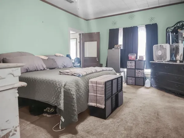 a bed room with a bed and a cabinets