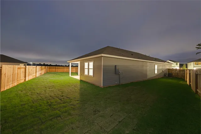 a view of a big yard with an outdoor space