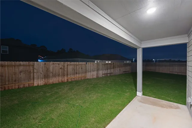 a view of backyard with green space