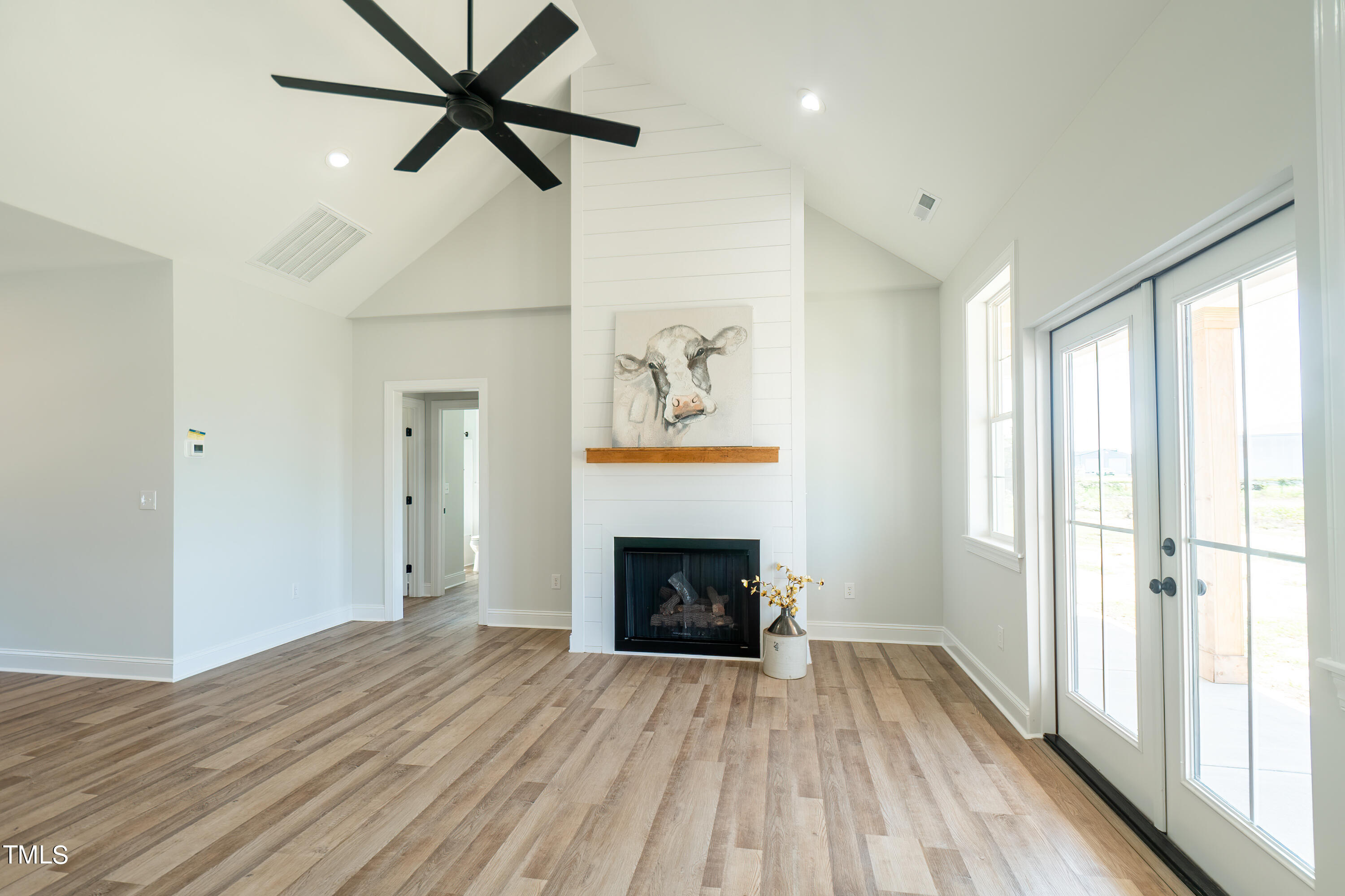 6591 Green Path Road Dunn, NC 28334 - Photo 11 of 25 a view of an empty room with fire place and a window