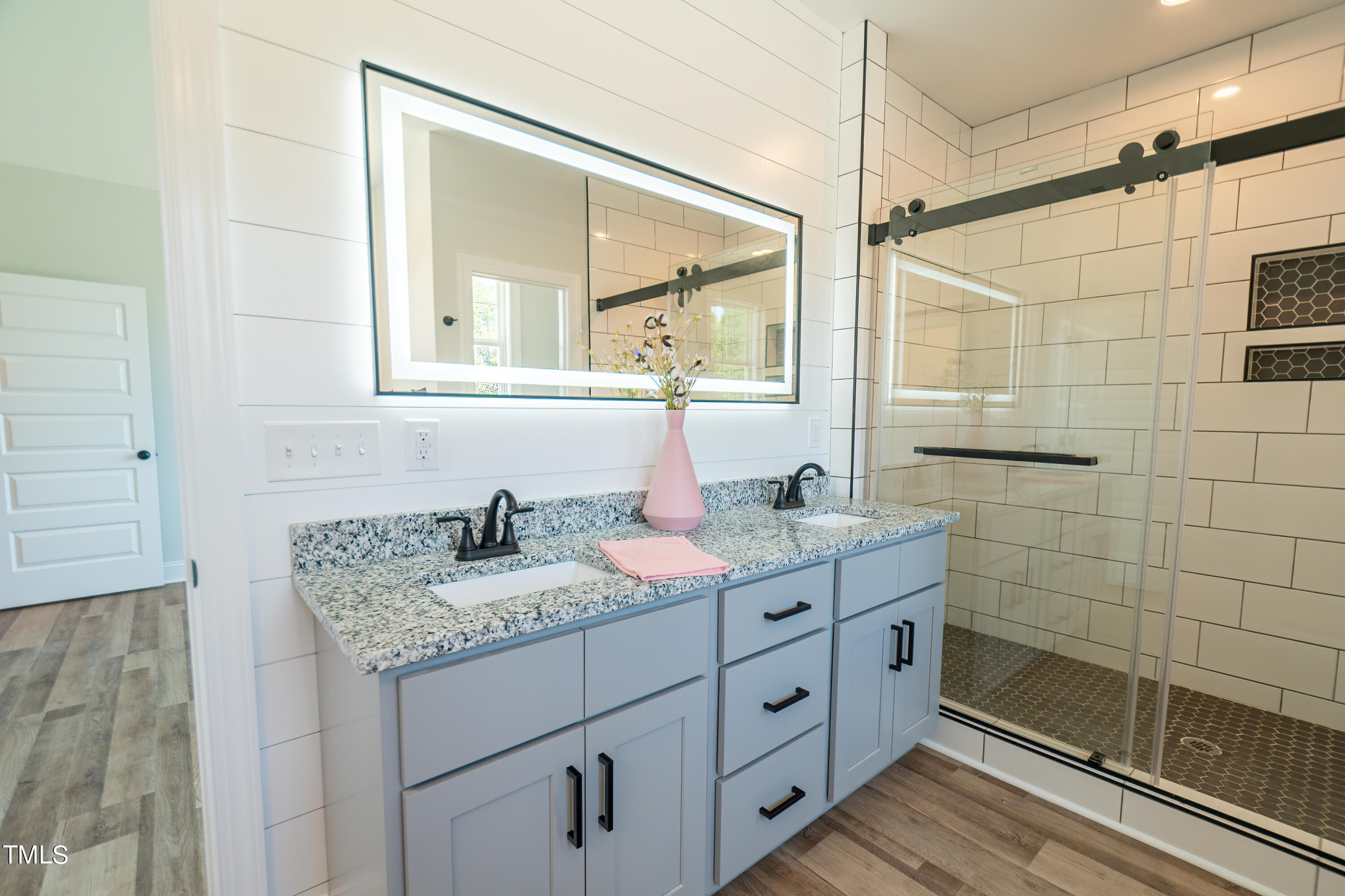 6591 Green Path Road Dunn, NC 28334 - Photo 15 of 25 a bathroom with a granite countertop sink mirror and double