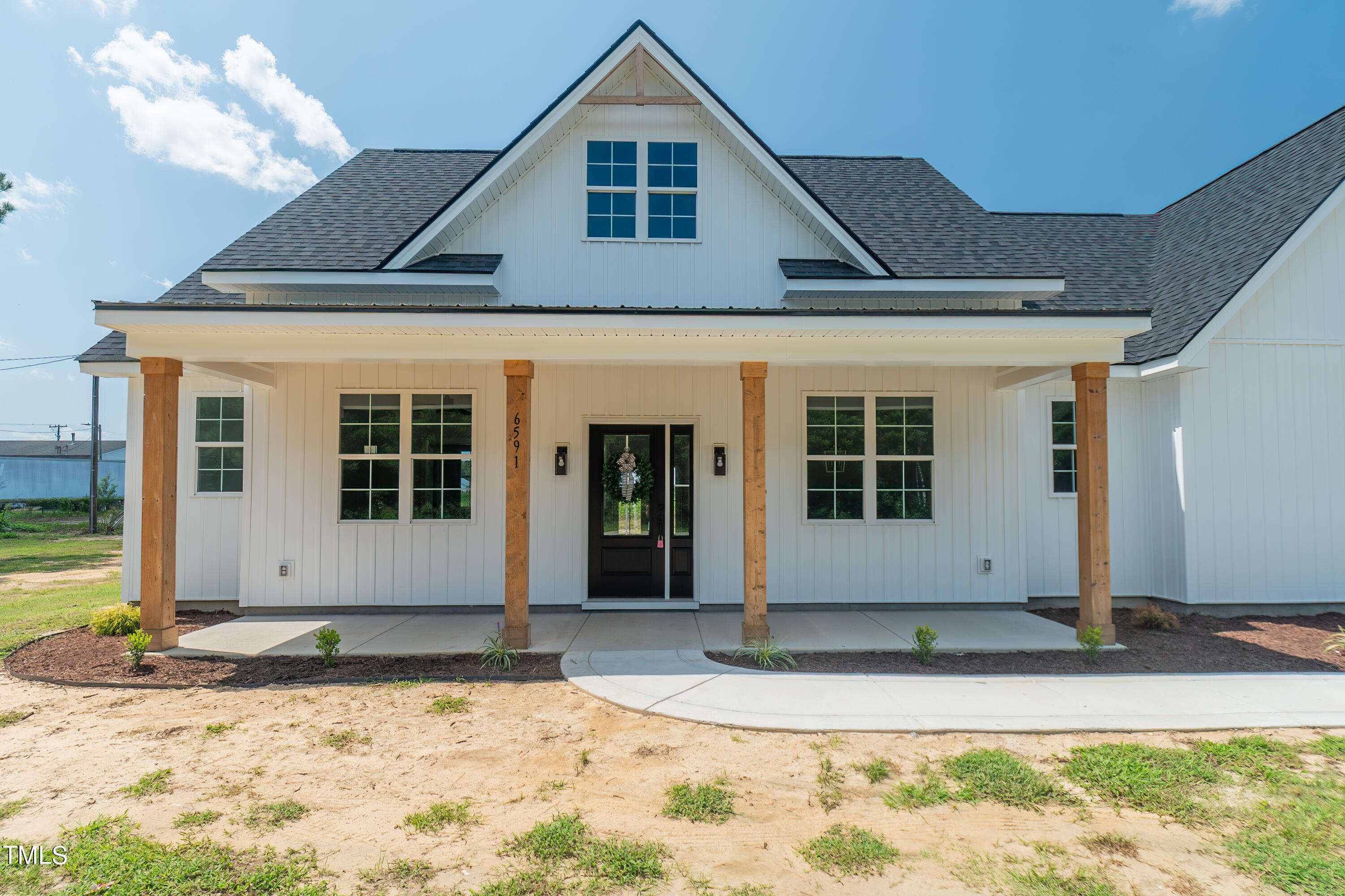 6591 Green Path Road Dunn, NC 28334 - Photo 2 of 25 a front view of a house