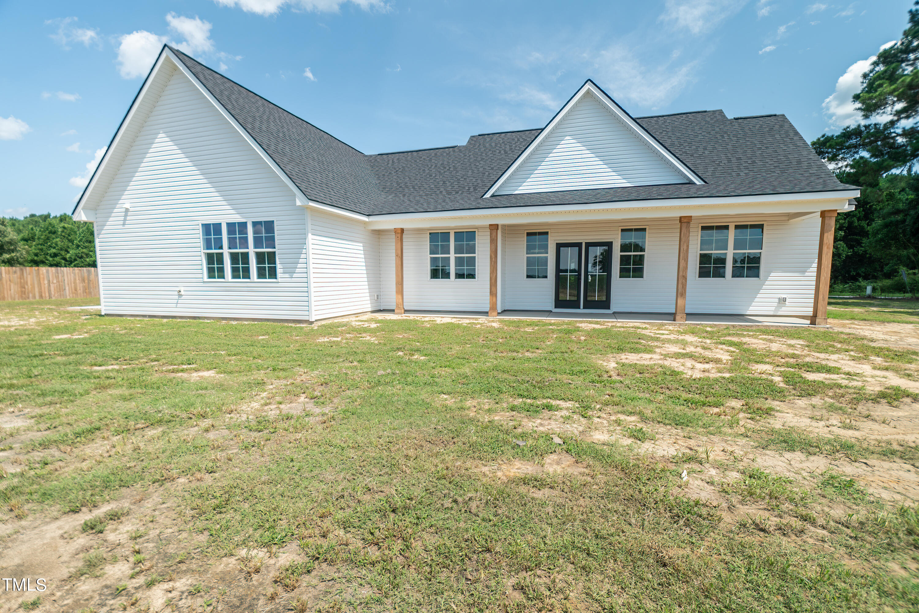 6591 Green Path Road Dunn, NC 28334 - Photo 25 of 25 a view of a house with a big yard and large trees