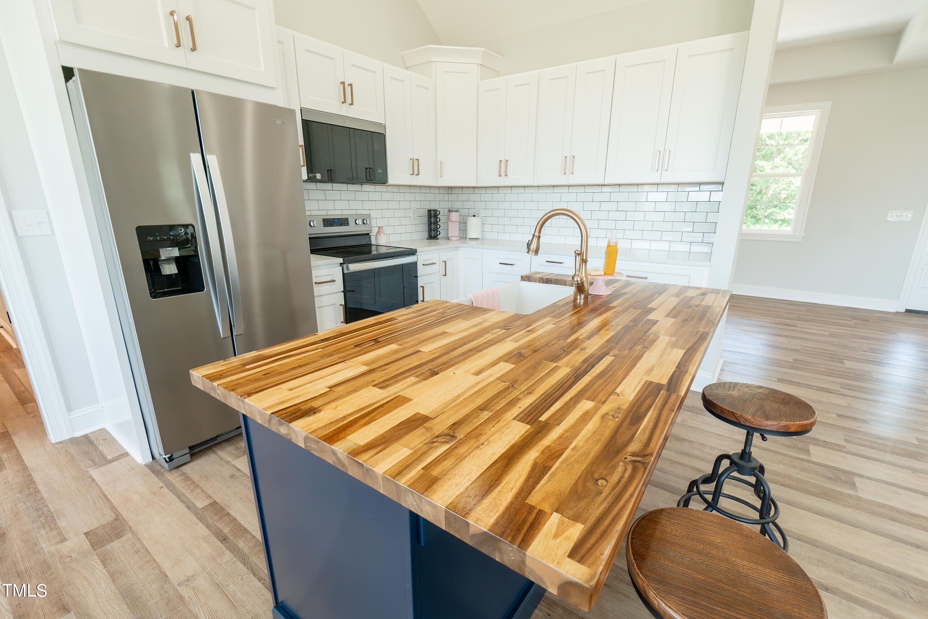 6591 Green Path Road Dunn, NC 28334 - Photo 8 of 25 a kitchen with kitchen island a appliances dining table and chairs