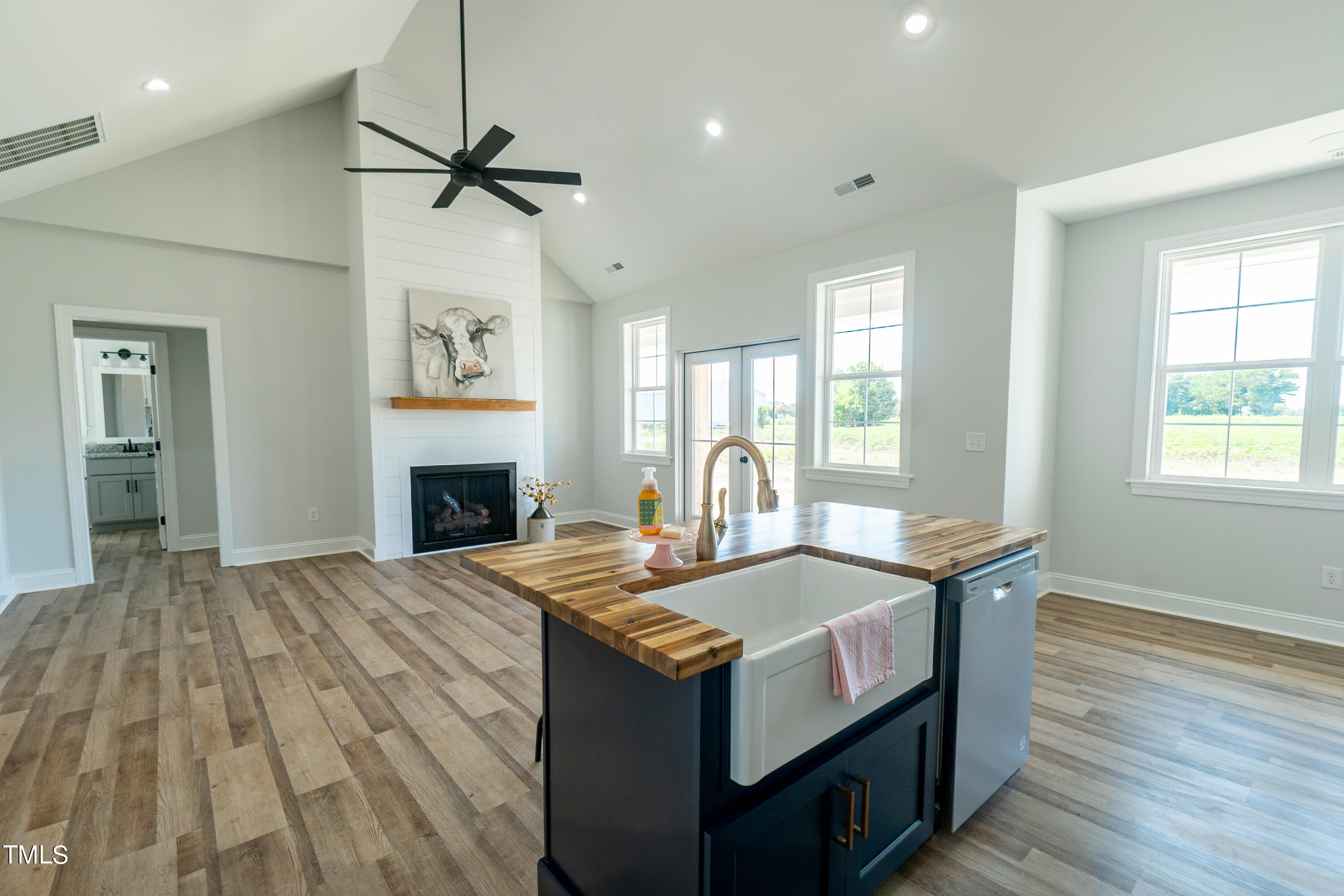 6591 Green Path Road Dunn, NC 28334 - Photo 10 of 25 a kitchen with a stove and a wooden floor