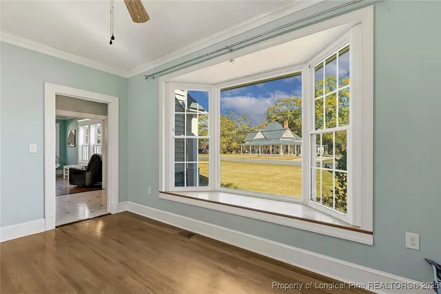 a view of a room that has a large window