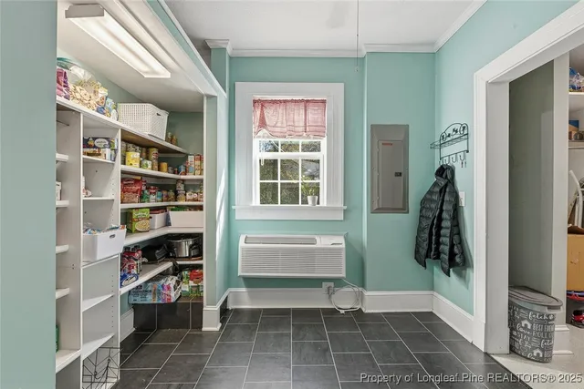 a view of walk in closet and window