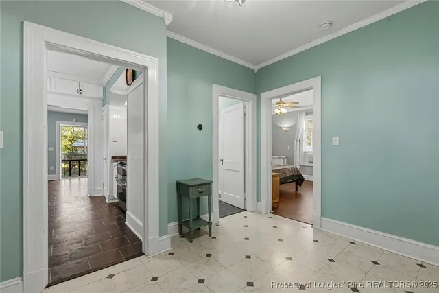 a view of a hallway with a wooden cabinets